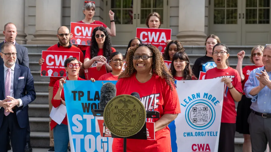 LanguageLine Solutions workers speaks at press conference in NYC. 