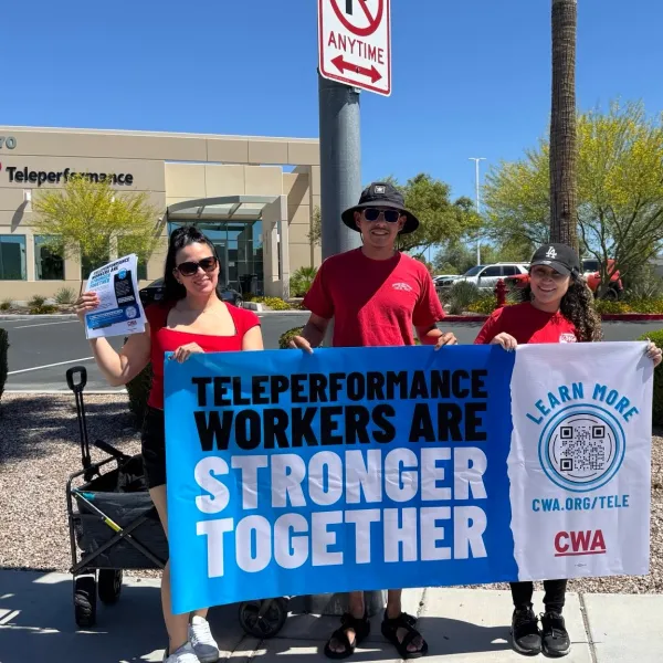 Workers with Teleperformance Banner